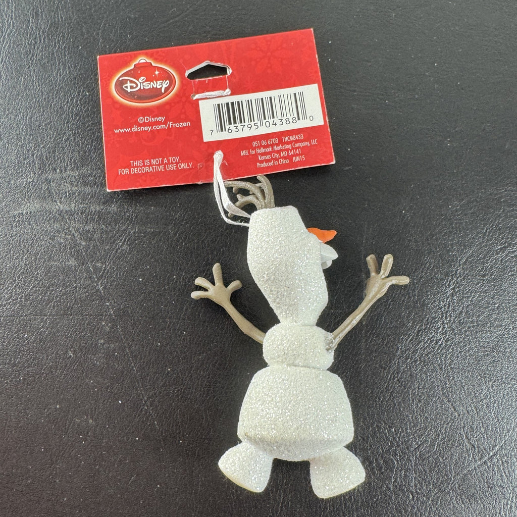 Hallmark 2015 Disney Frozen Olaf glitter resin Christmas tree ornament with original hang tag attached.