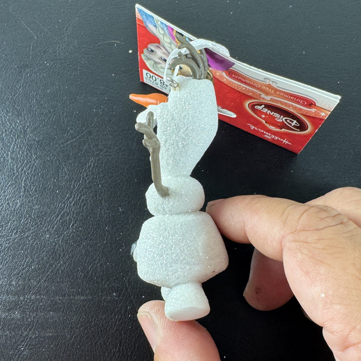 Hallmark 2015 Disney Frozen Olaf glitter resin Christmas tree ornament with original hang tag attached.