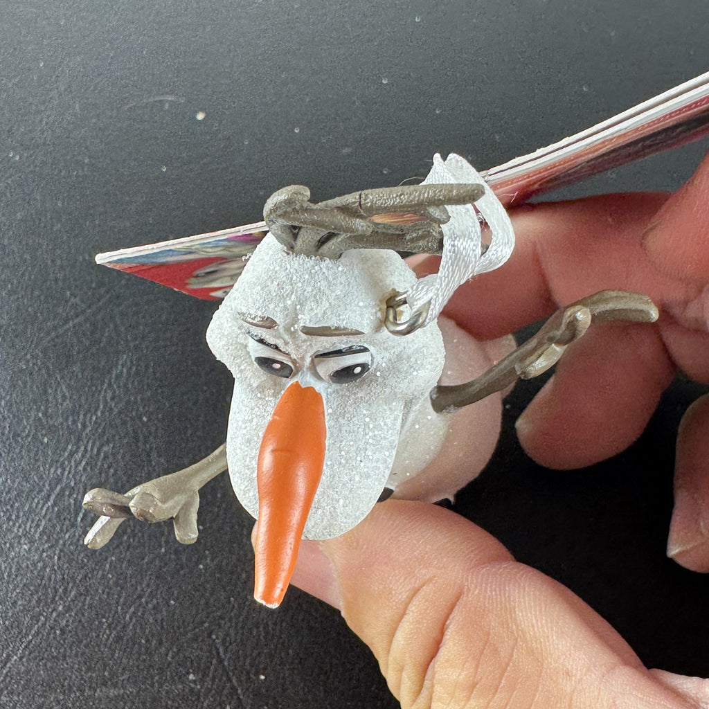 Hallmark 2015 Disney Frozen Olaf glitter resin Christmas tree ornament with original hang tag attached.