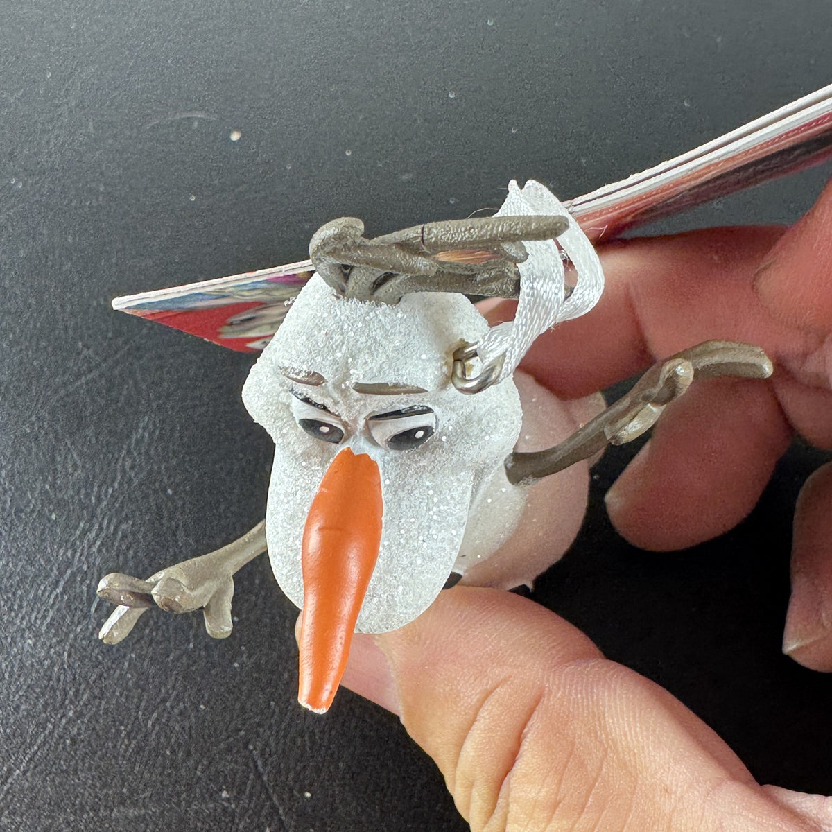 Hallmark 2015 Disney Frozen Olaf glitter resin Christmas tree ornament with original hang tag attached.