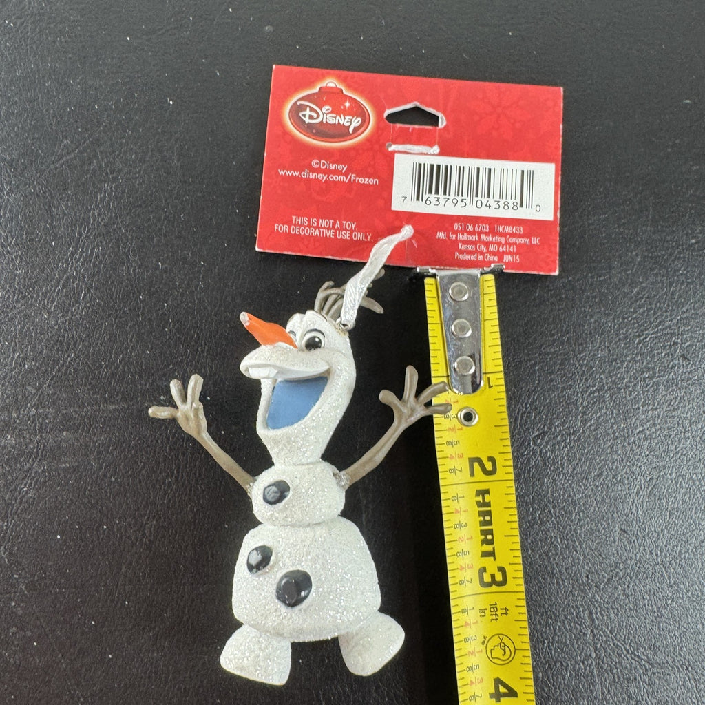 Hallmark 2015 Disney Frozen Olaf glitter resin Christmas tree ornament with original hang tag attached.