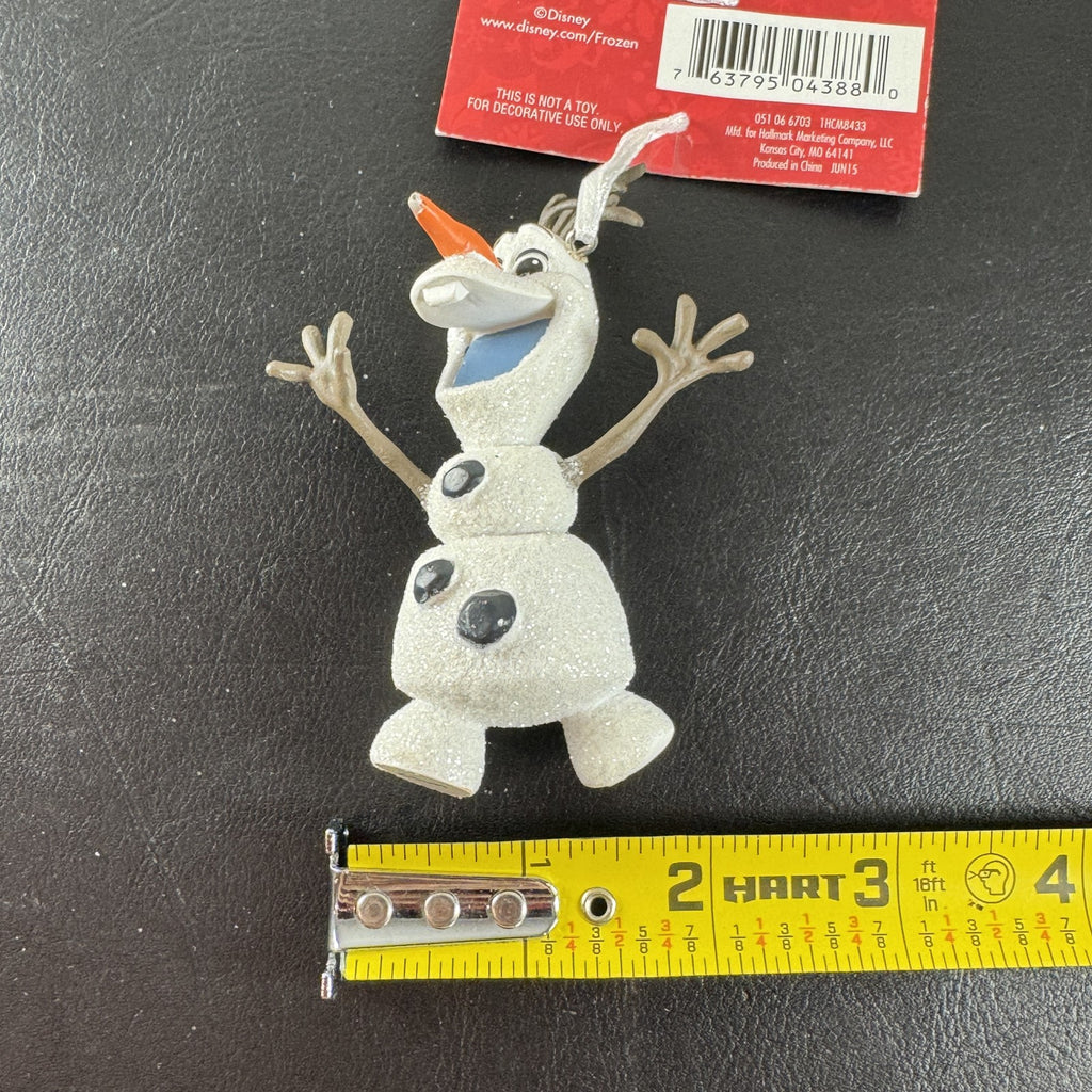 Hallmark 2015 Disney Frozen Olaf glitter resin Christmas tree ornament with original hang tag attached.