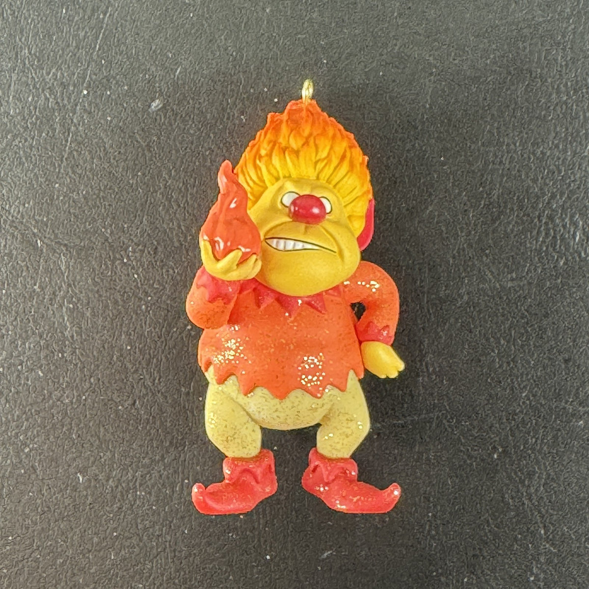 2015 Hallmark Keepsake Heat Miser resin Christmas ornament featuring glitter accents and gold hanging loop.