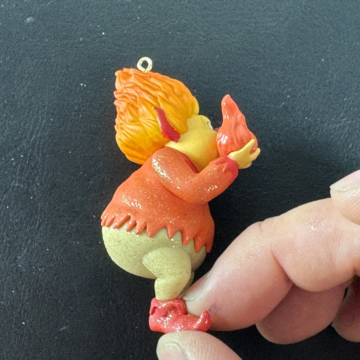 2015 Hallmark Keepsake Heat Miser resin Christmas ornament featuring glitter accents and gold hanging loop.
