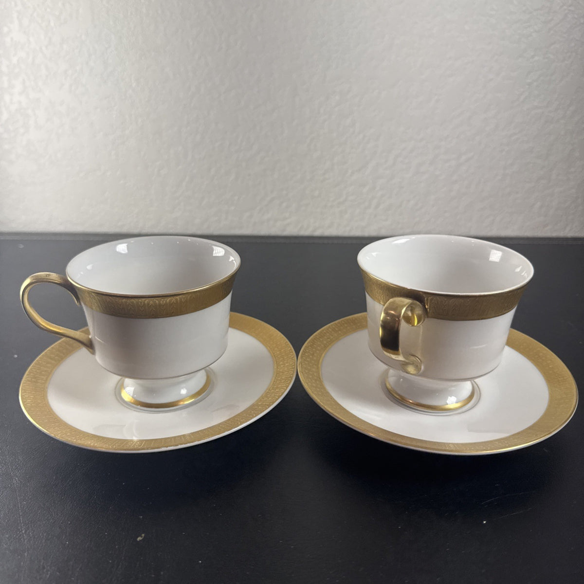Sango Georgetown fine china teacup and saucer set of 2 featuring white porcelain with gold encrusted border trim.