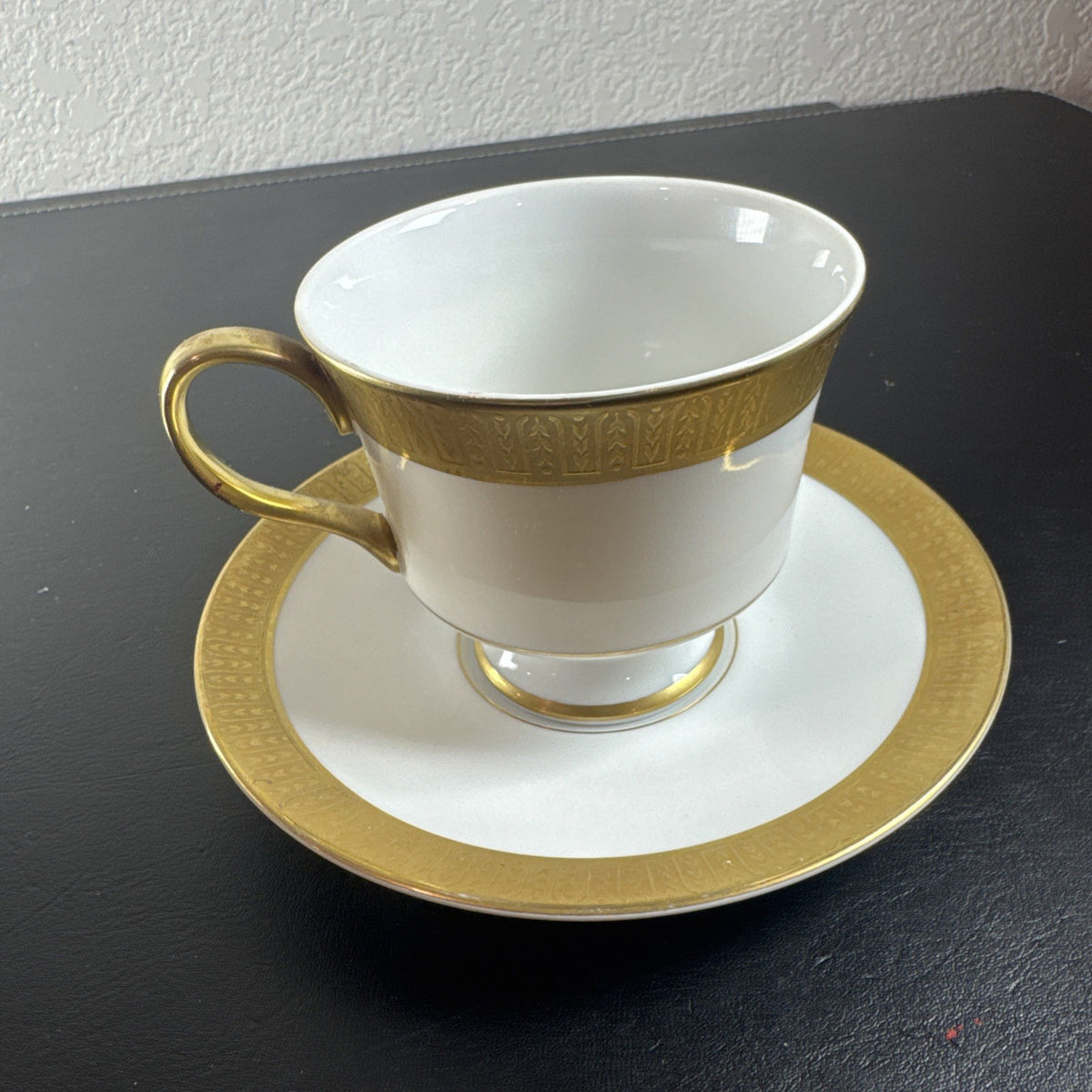 Sango Georgetown fine china teacup and saucer set of 2 featuring white porcelain with gold encrusted border trim.