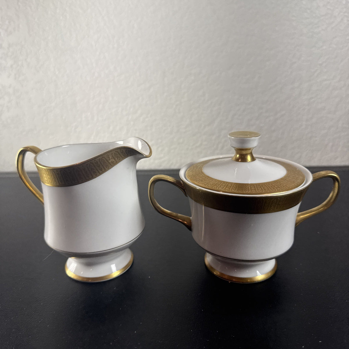 Sango Georgetown pattern 3755 fine china creamer pitcher and covered sugar bowl set with gold handles and trim.