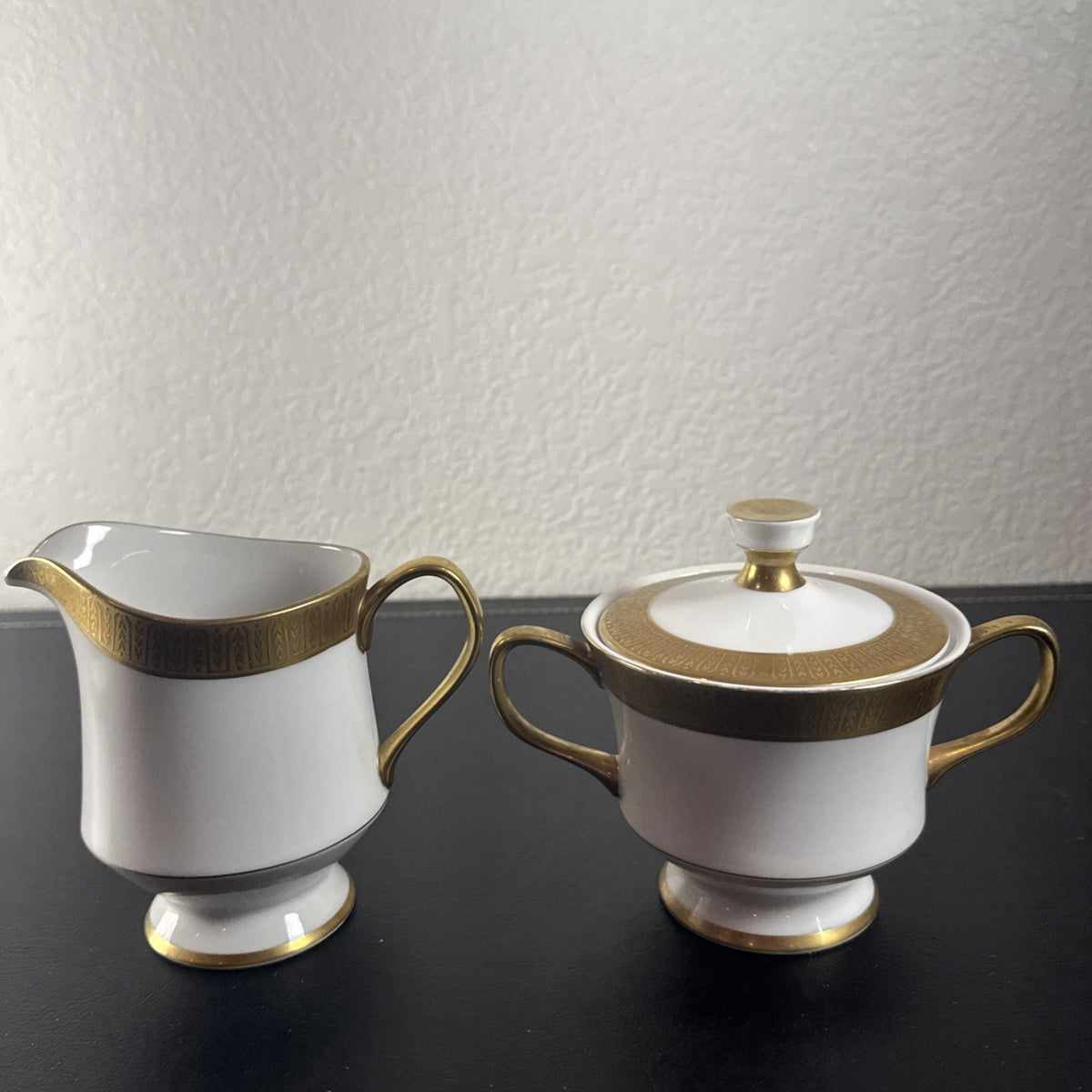 Sango Georgetown pattern 3755 fine china creamer pitcher and covered sugar bowl set with gold handles and trim.