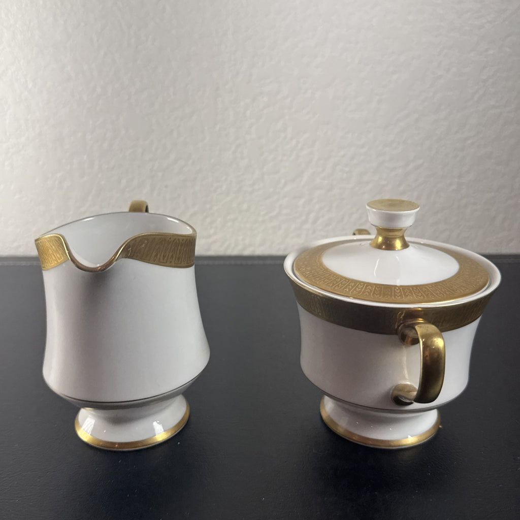 Sango Georgetown pattern 3755 fine china creamer pitcher and covered sugar bowl set with gold handles and trim.