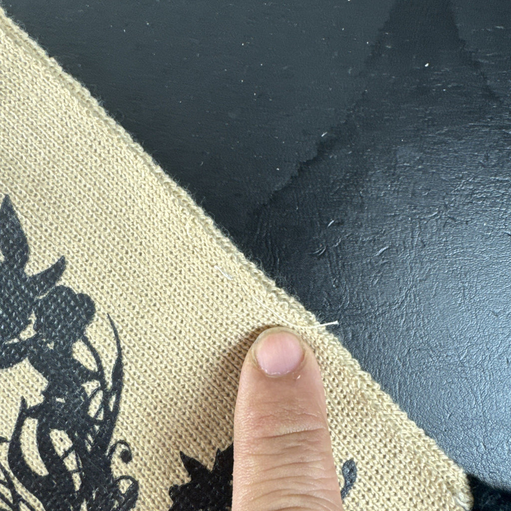 Tan knit Twilight Saga New Moon promo scarf featuring the Cullen family crest and black fringe tassels.