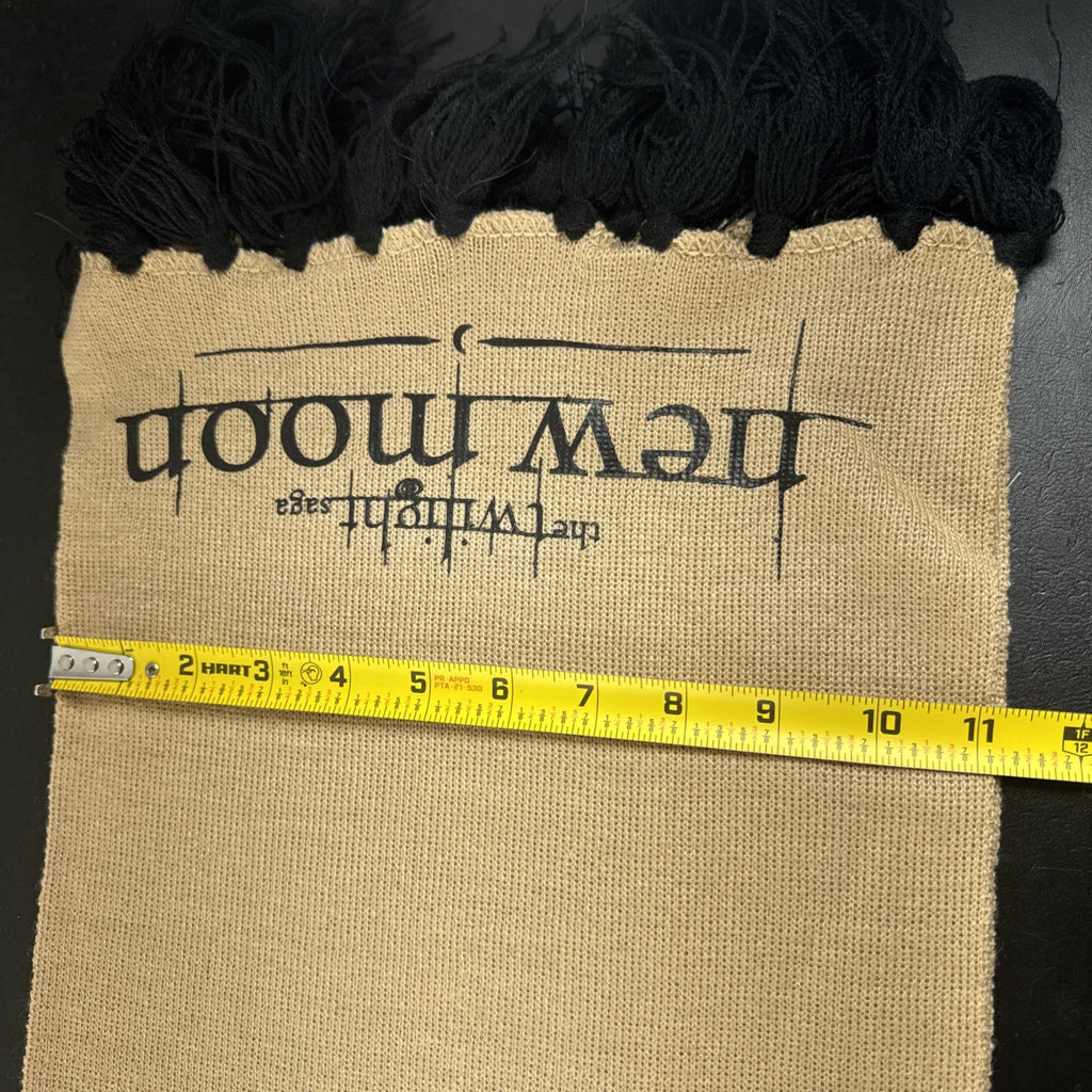 Tan knit Twilight Saga New Moon promo scarf featuring the Cullen family crest and black fringe tassels.