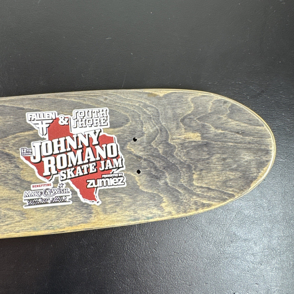 Johnny Romano Skate Jam 16-inch promotional mini skateboard deck featuring intact event graphics and stained wood grain.