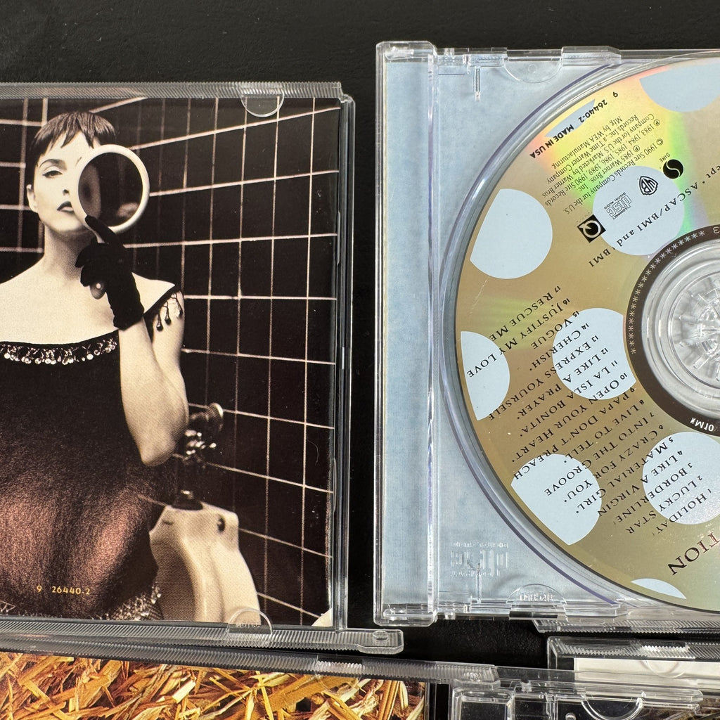 Lot of 4 Madonna CDs including The Immaculate Collection, American Life, and two Music album cover variants.