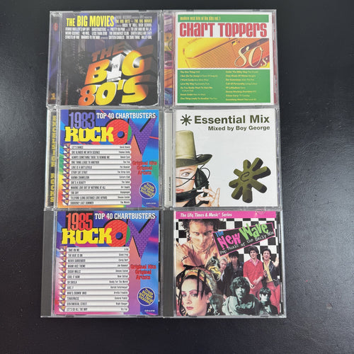 Set of 6 pre-owned 1980s compilation CDs including 80s movie hits and new wave rock collections.