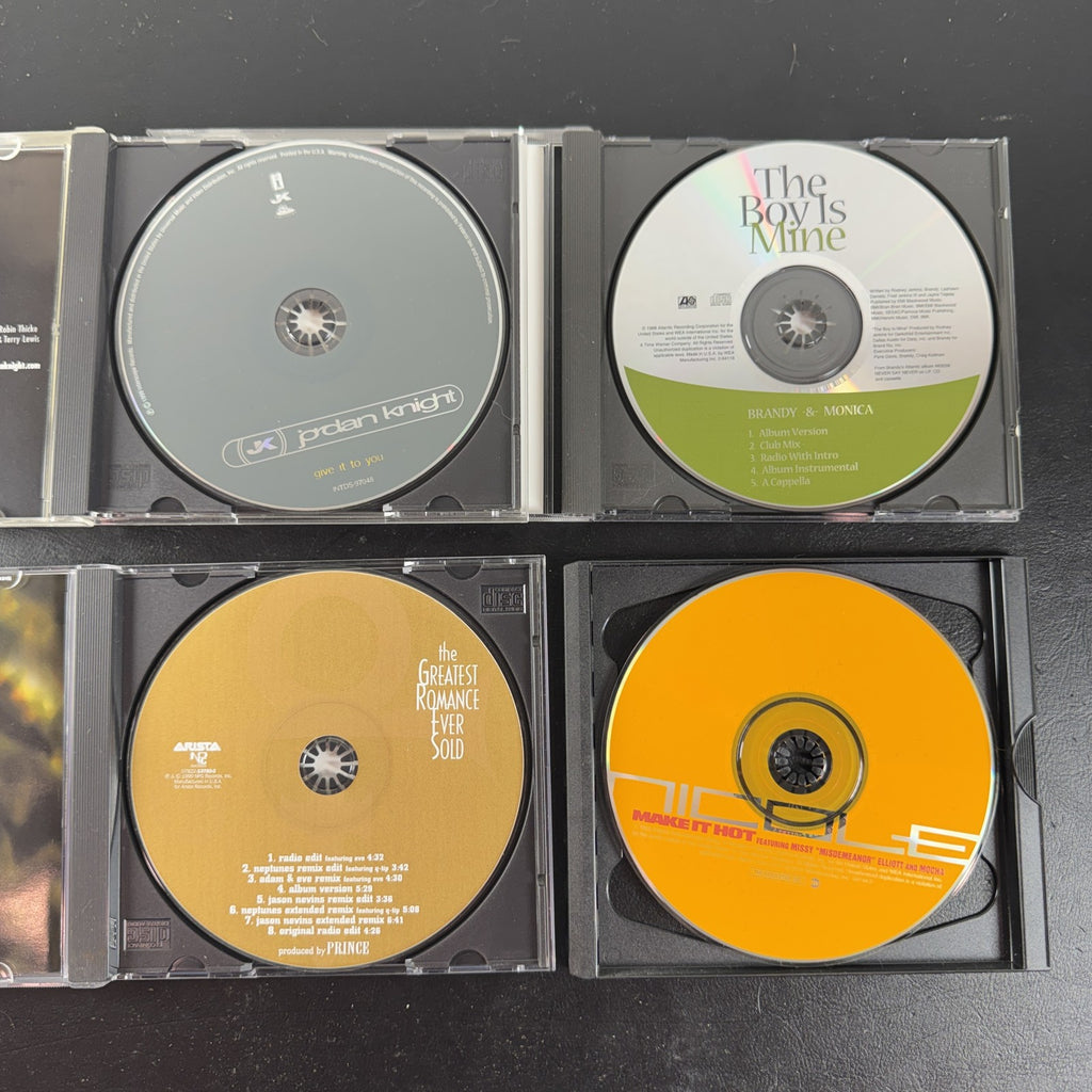 Lot of four late 90s R&B and pop CD singles featuring Brandy and Monica, Prince, Jordan Knight, and Nicole.