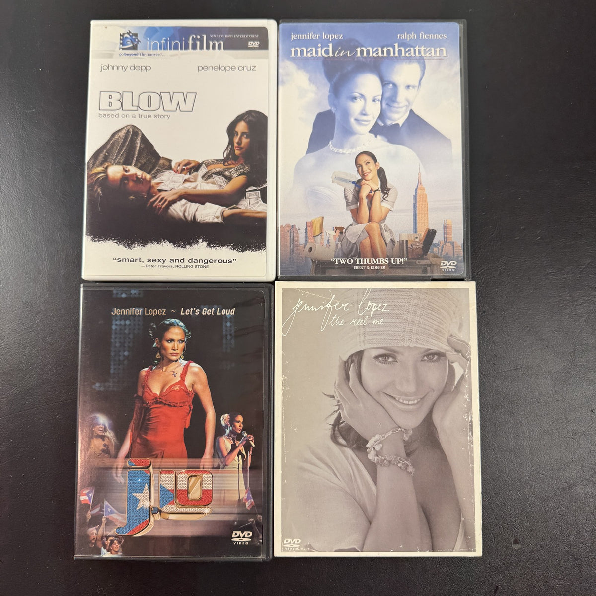 Set of 4 pre-owned DVDs including Blow starring Johnny Depp and Jennifer Lopez movies and music specials.