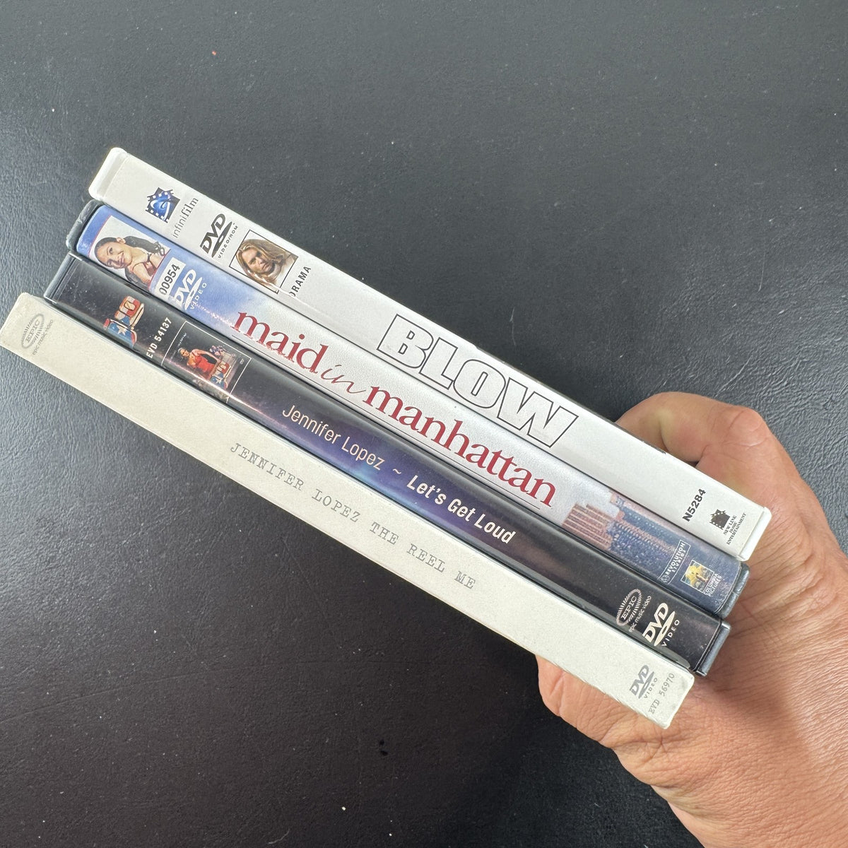 Set of 4 pre-owned DVDs including Blow starring Johnny Depp and Jennifer Lopez movies and music specials.