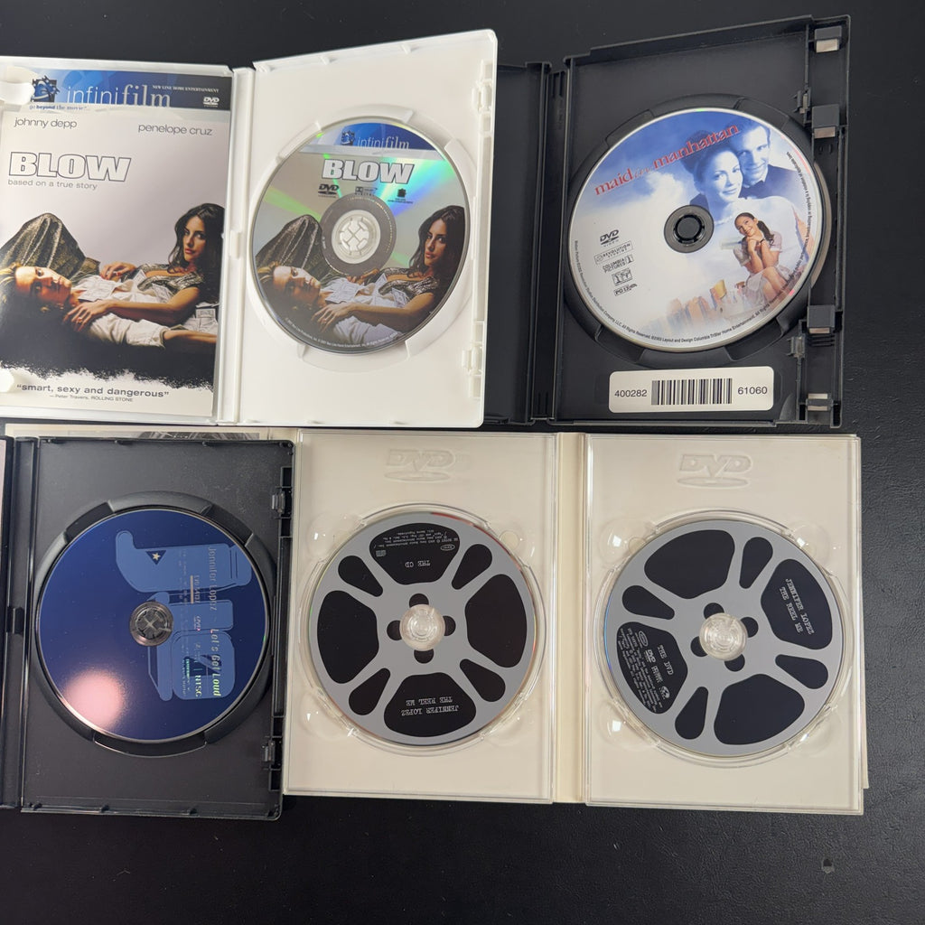 Set of 4 pre-owned DVDs including Blow starring Johnny Depp and Jennifer Lopez movies and music specials.
