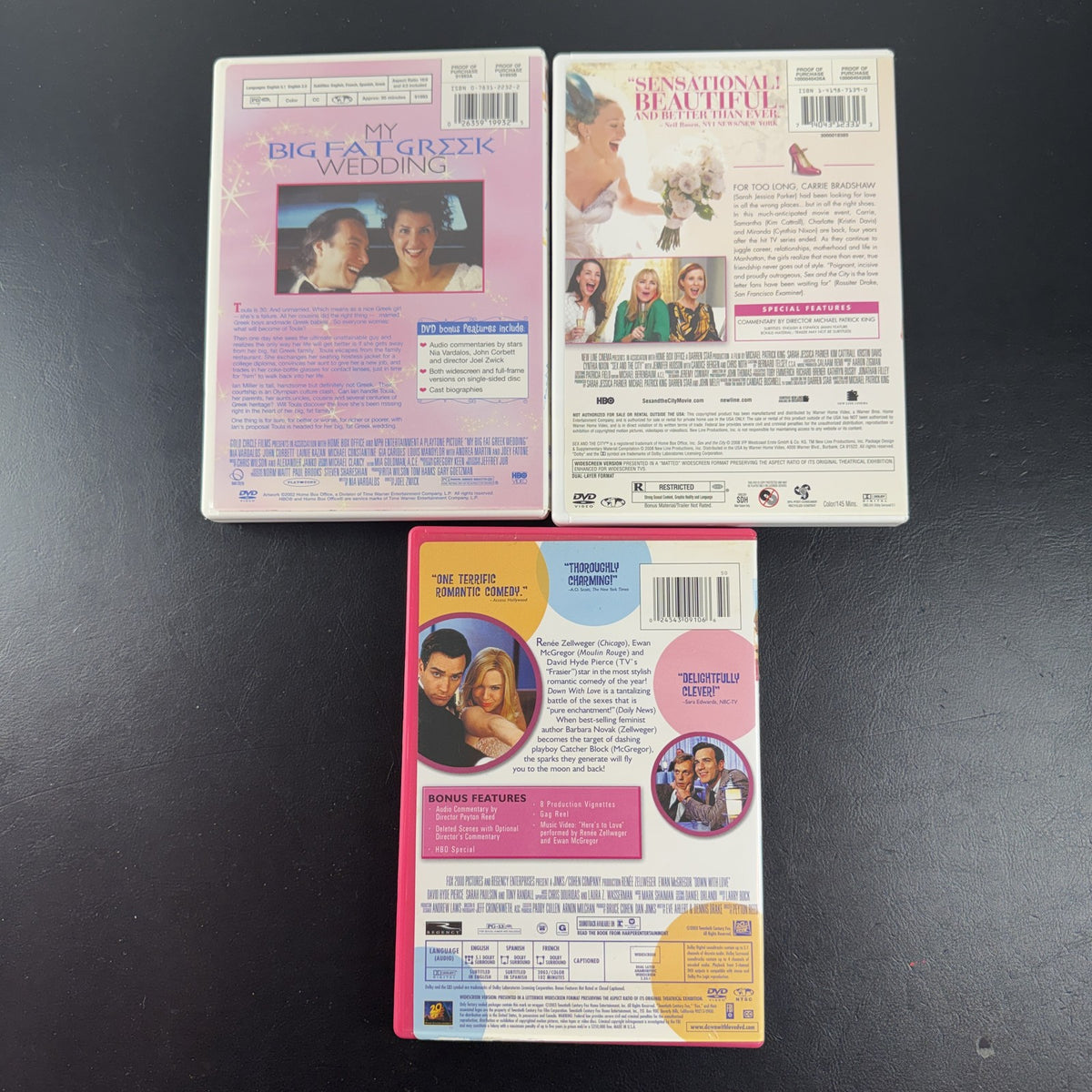 Set of 3 romantic comedy DVDs including Sex and the City, My Big Fat Greek Wedding, and Down with Love.