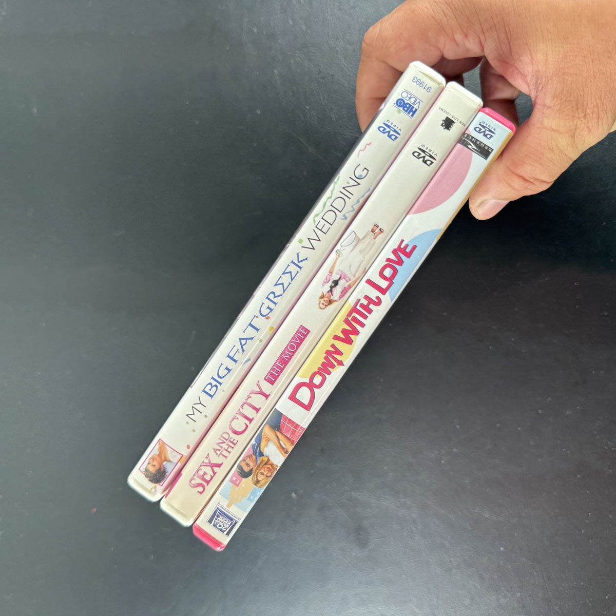 Set of 3 romantic comedy DVDs including Sex and the City, My Big Fat Greek Wedding, and Down with Love.