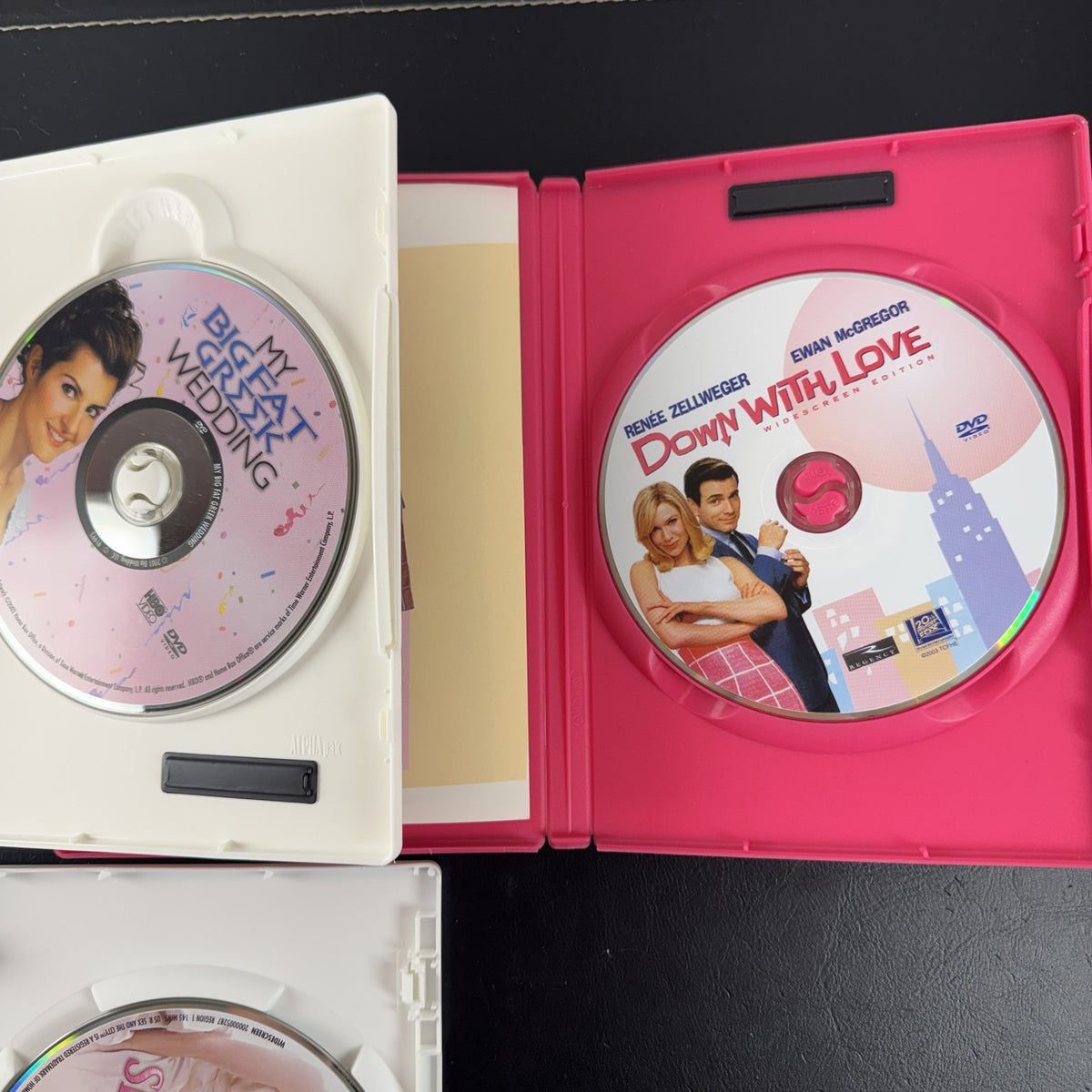 Set of 3 romantic comedy DVDs including Sex and the City, My Big Fat Greek Wedding, and Down with Love.