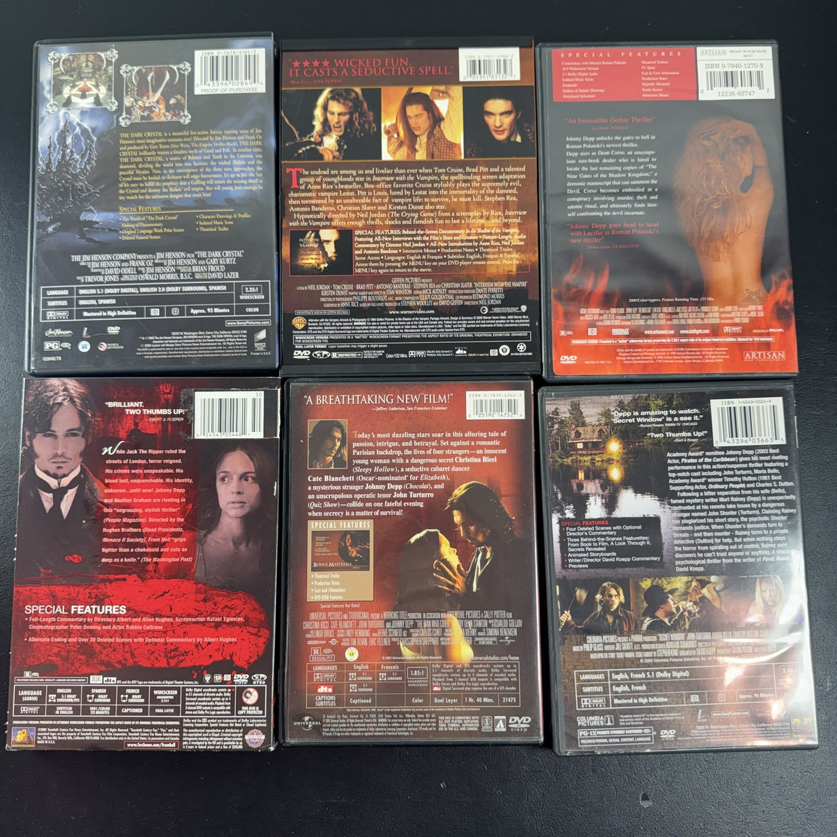 Collection of 6 dark fantasy and thriller DVD cases including The Dark Crystal and Interview with the Vampire