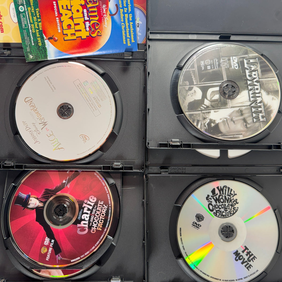 Set of 6 pre-owned family fantasy DVDs including Labyrinth, Frozen, The Iron Giant, and Alice in Wonderland