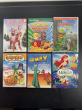 Collection of 6 family animation DVDs including Disney's The Little Mermaid, Scooby-Doo, and Garfield in cases.