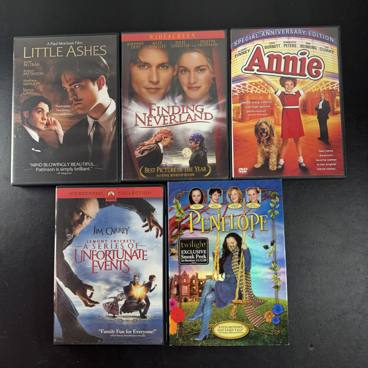 Collection of 5 pre-owned DVD movie cases including Finding Neverland, Annie, and A Series of Unfortunate Events.