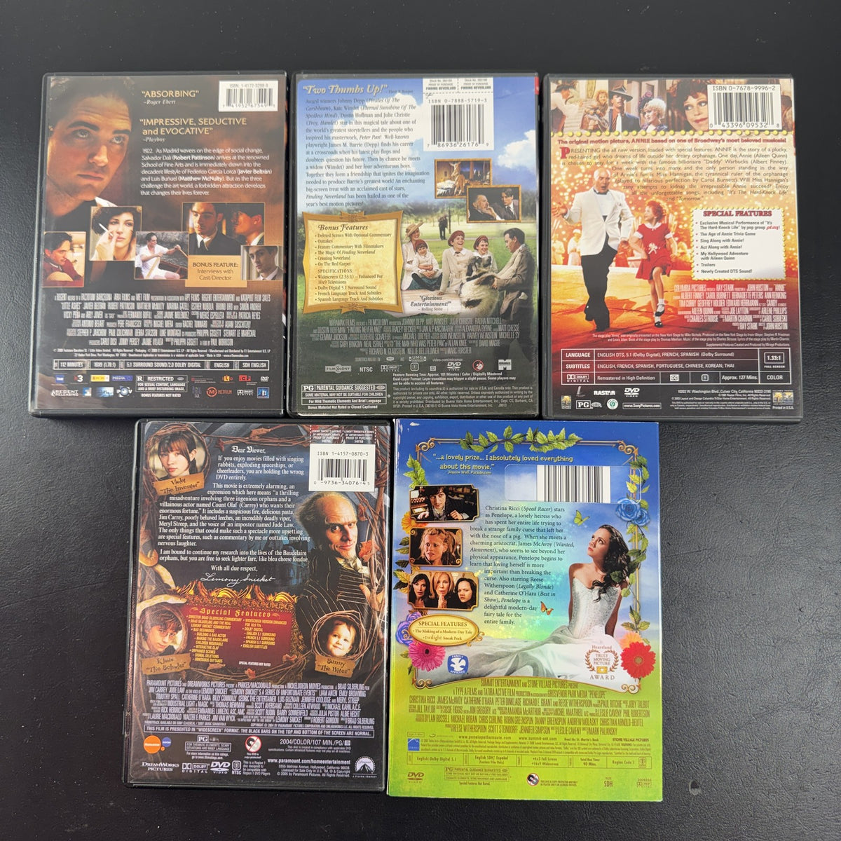 Collection of 5 pre-owned DVD movie cases including Finding Neverland, Annie, and A Series of Unfortunate Events.