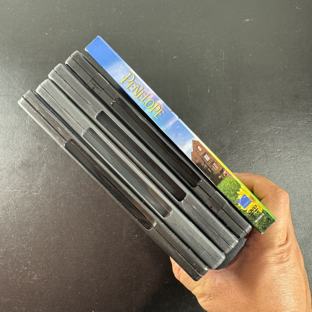 Collection of 5 pre-owned DVD movie cases including Finding Neverland, Annie, and A Series of Unfortunate Events.