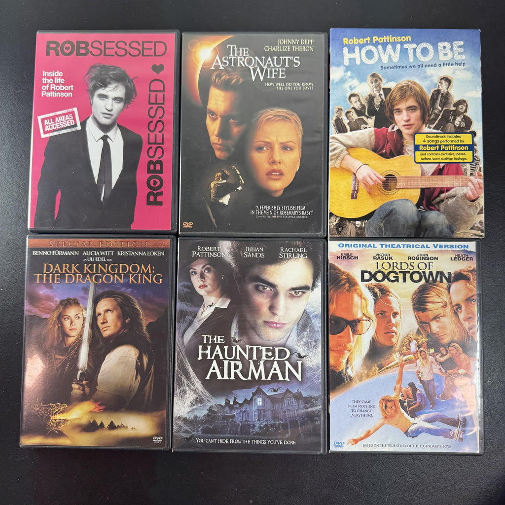Collection of 6 DVD cases including Lords of Dogtown and Robert Pattinson movies.
