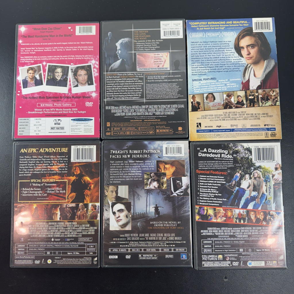 Collection of 6 DVD cases including Lords of Dogtown and Robert Pattinson movies.
