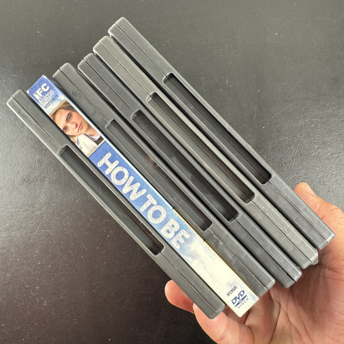 Collection of 6 DVD cases including Lords of Dogtown and Robert Pattinson movies.