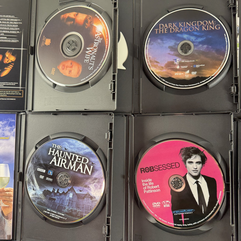 Collection of 6 DVD cases including Lords of Dogtown and Robert Pattinson movies.