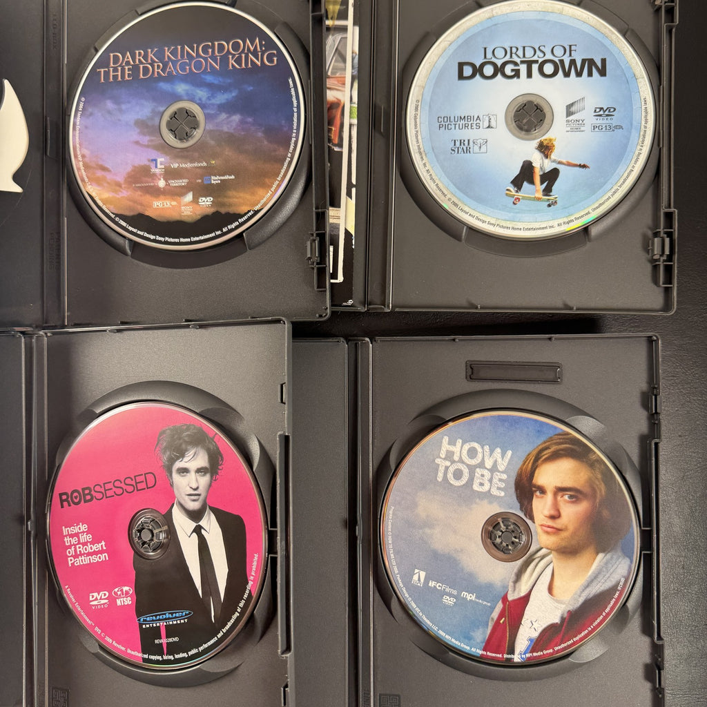 Collection of 6 DVD cases including Lords of Dogtown and Robert Pattinson movies.