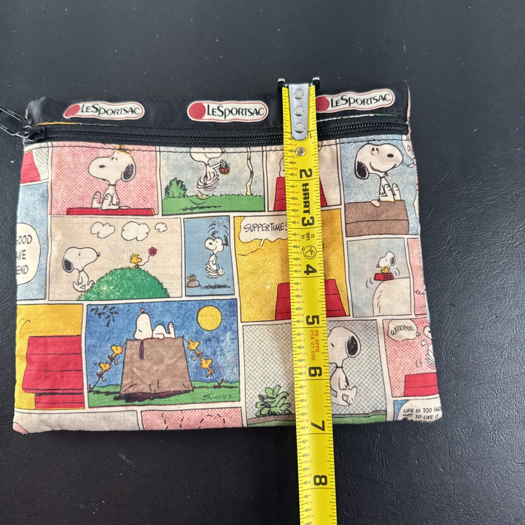 LeSportsac x Peanuts Snoopy vintage comic strip cosmetic pouch with top zip and black trim.