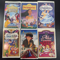 Set of 6 vintage Disney animated VHS tapes in original white clamshell cases including Cinderella and Sleeping Beauty.