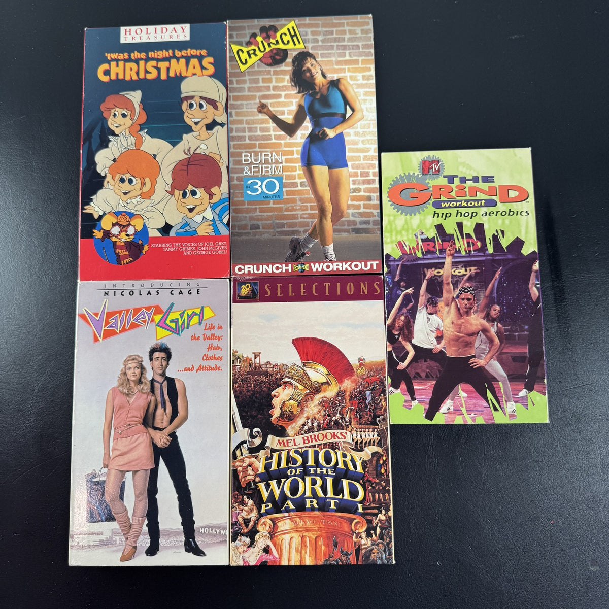 Lot of 5 vintage VHS tapes including Valley Girl, History of the World Part I, MTV The Grind, and Crunch Workout.
