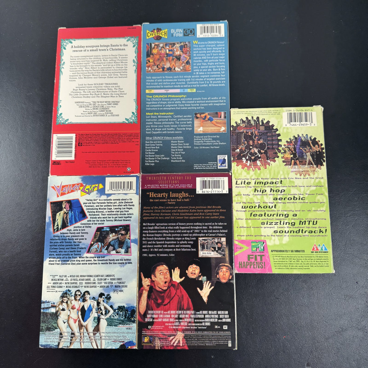 Lot of 5 vintage VHS tapes including Valley Girl, History of the World Part I, MTV The Grind, and Crunch Workout.