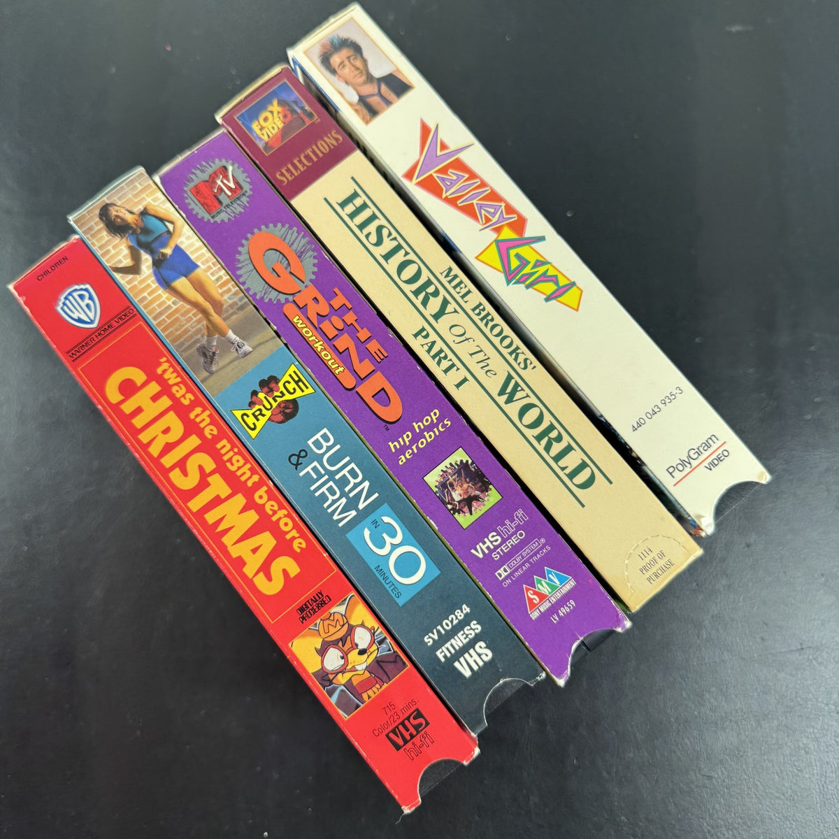 Lot of 5 vintage VHS tapes including Valley Girl, History of the World Part I, MTV The Grind, and Crunch Workout.