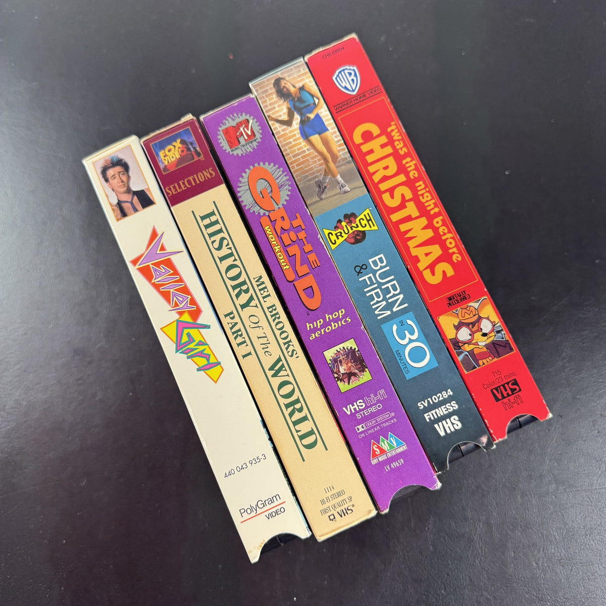 Lot of 5 vintage VHS tapes including Valley Girl, History of the World Part I, MTV The Grind, and Crunch Workout.