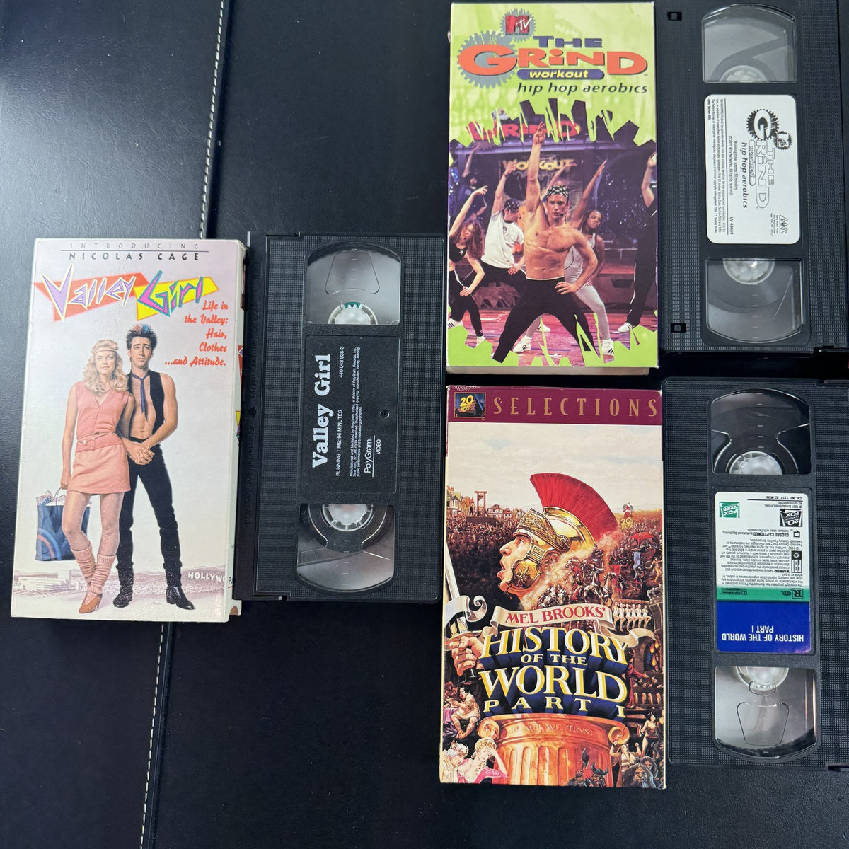 Lot of 5 vintage VHS tapes including Valley Girl, History of the World Part I, MTV The Grind, and Crunch Workout.