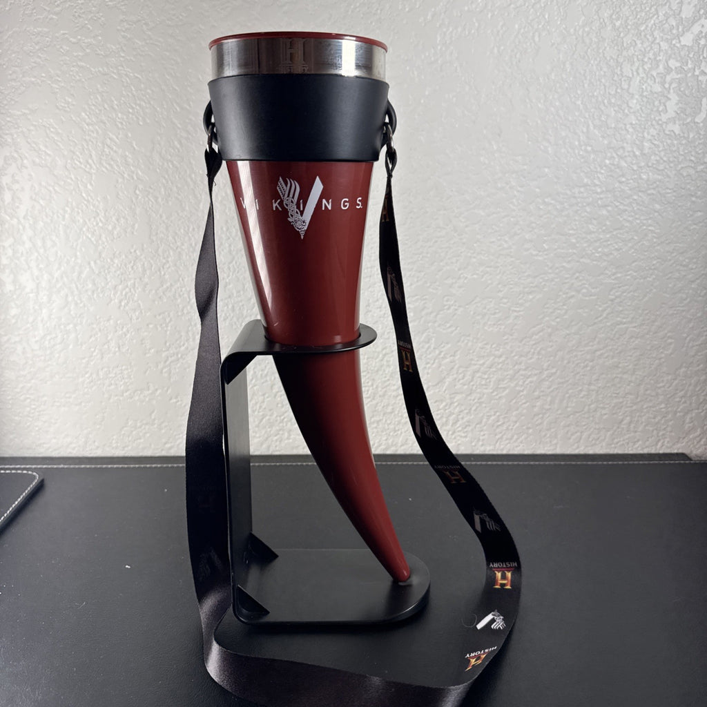 Red Das Horn Vikings History Channel promotional drinking horn with black display stand and lanyard.
