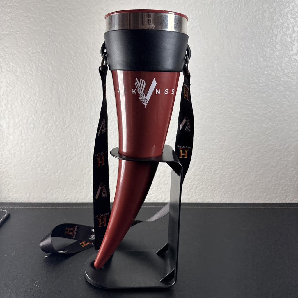 Red Das Horn Vikings History Channel promotional drinking horn with black display stand and lanyard.