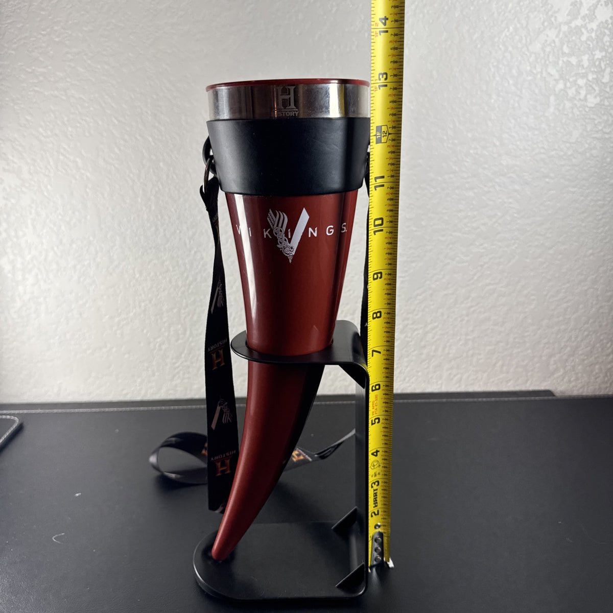Red Das Horn Vikings History Channel promotional drinking horn with black display stand and lanyard.