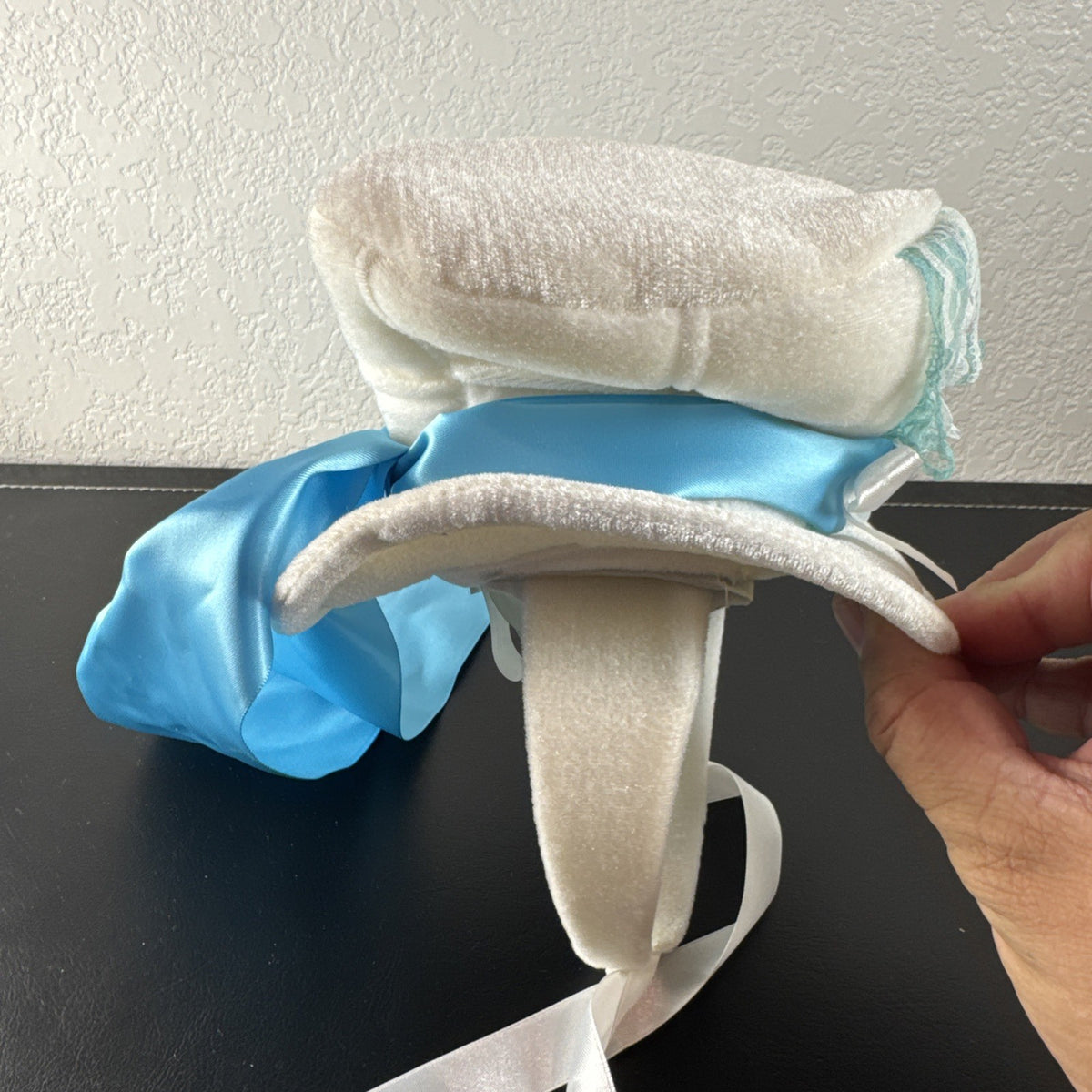 Elope Disney Alice in Wonderland white plush mini top hat headband with blue lace and satin ribbon sash.
