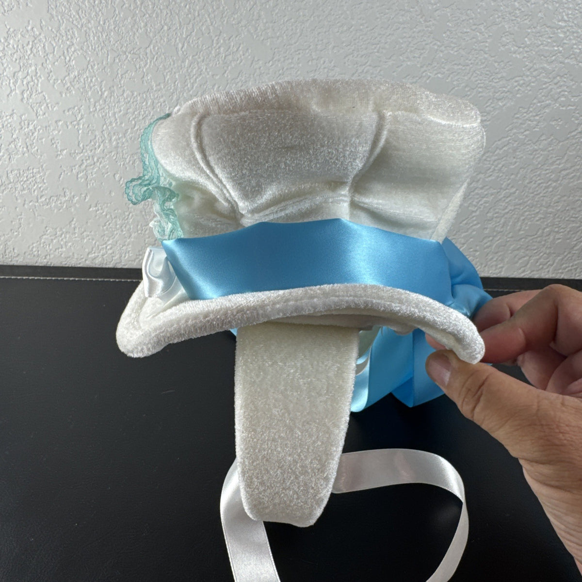Elope Disney Alice in Wonderland white plush mini top hat headband with blue lace and satin ribbon sash.