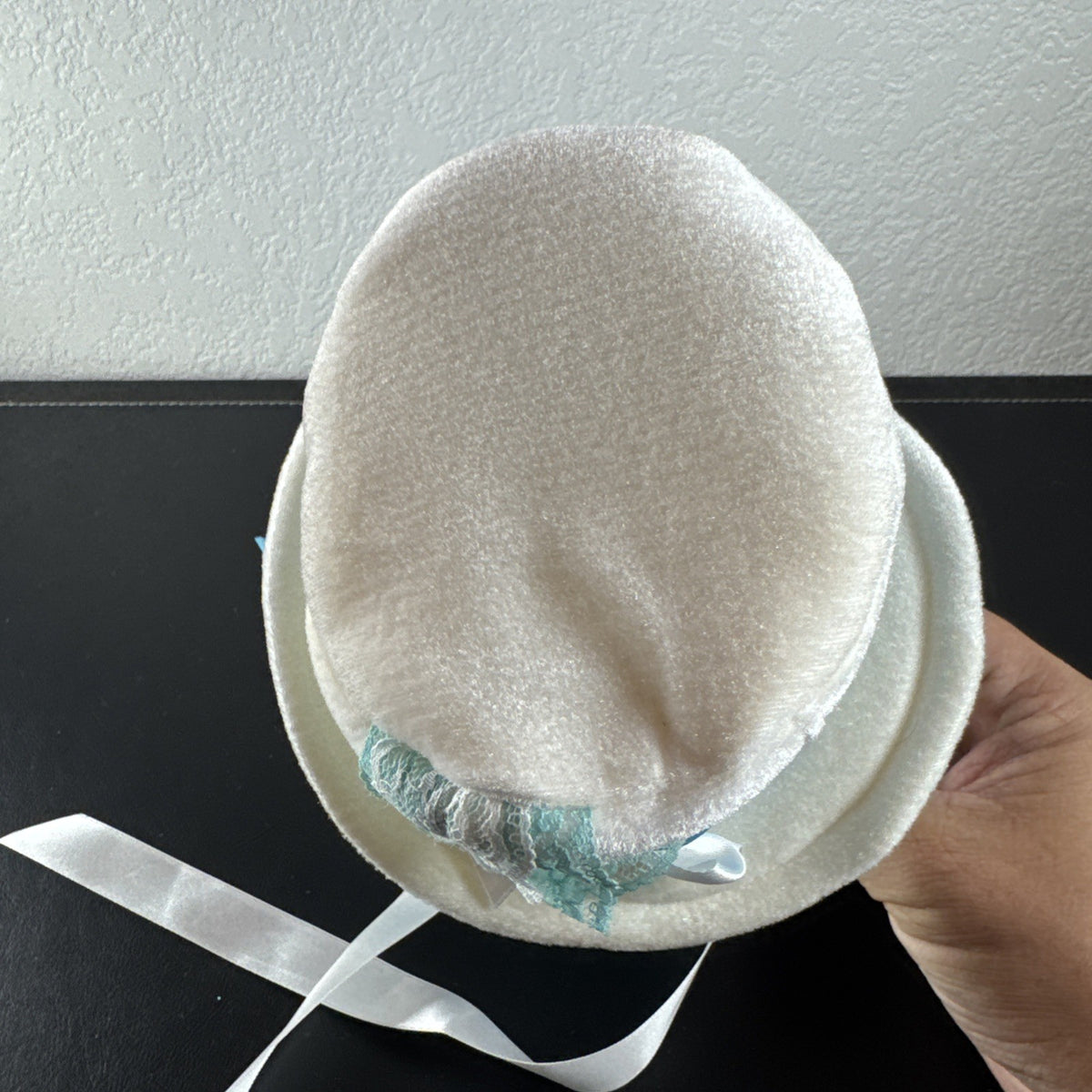 Elope Disney Alice in Wonderland white plush mini top hat headband with blue lace and satin ribbon sash.