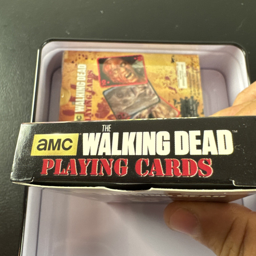 The Walking Dead playing card set with two decks and metal tin by Cardinal featuring Daryl and Merle Dixon.